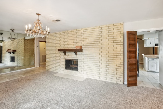 unfurnished living room featuring brick wall, a chandelier, light colored carpet, and a fireplace