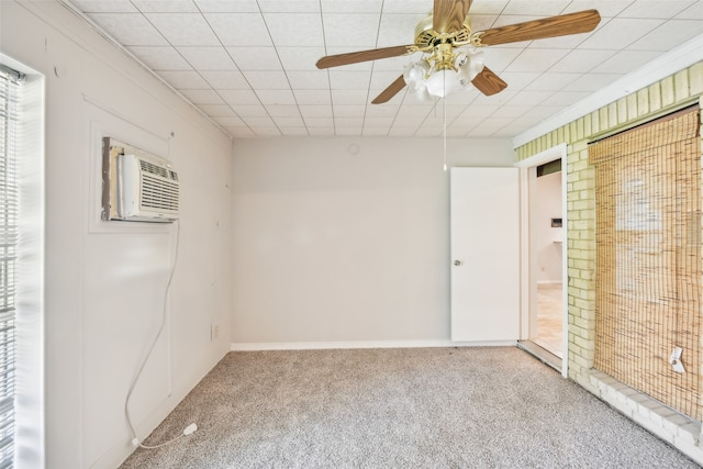 unfurnished room featuring a wall unit AC, ceiling fan, and light carpet