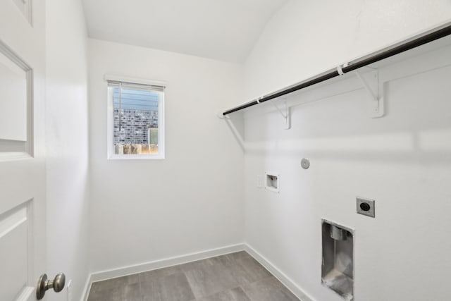 laundry area with hookup for a washing machine, gas dryer hookup, hookup for an electric dryer, and light hardwood / wood-style flooring