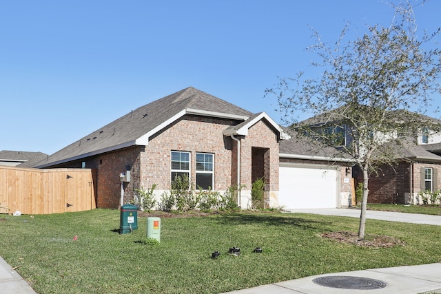 view of front of property with a garage and a front yard