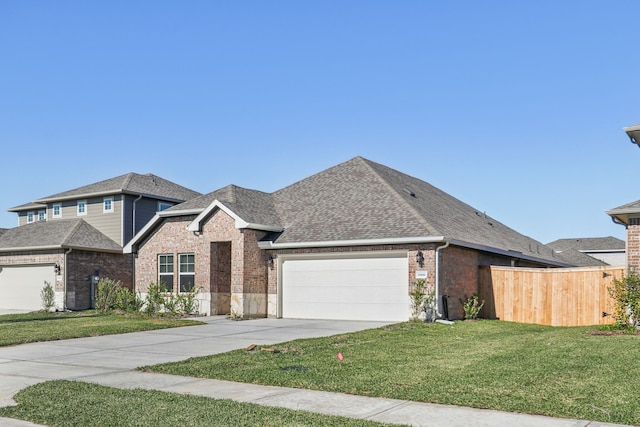 view of front of property with a garage and a front yard