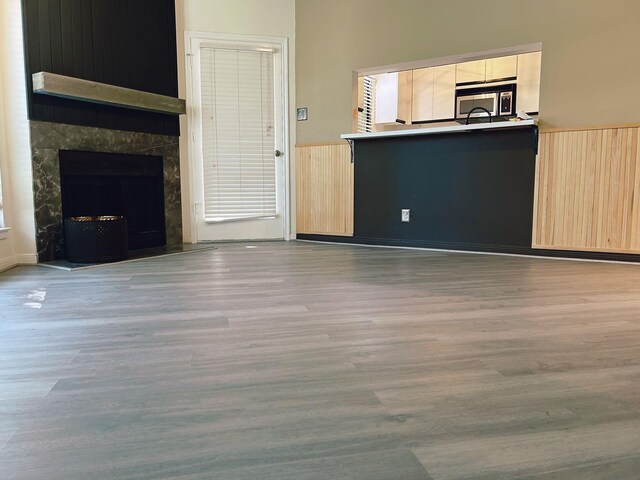 unfurnished living room with light hardwood / wood-style flooring