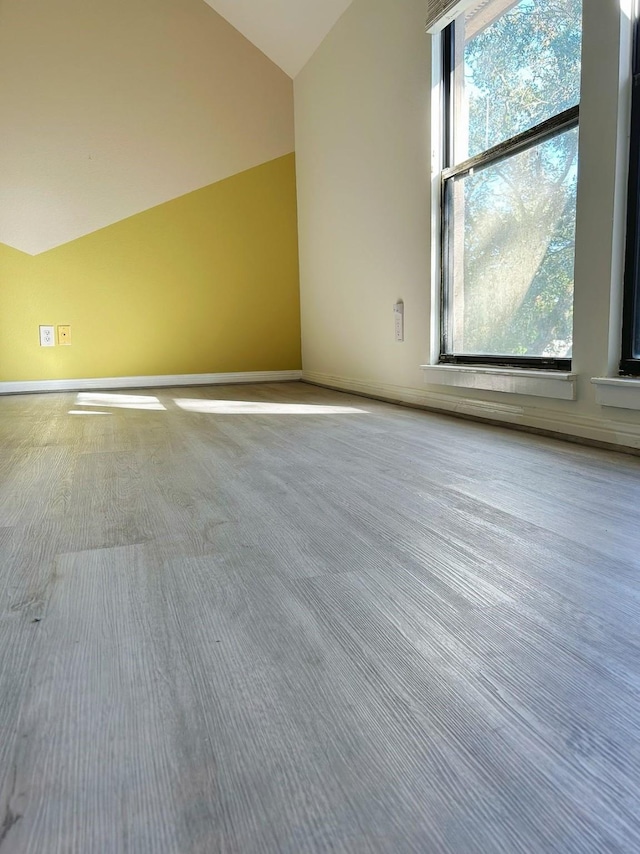 bonus room with lofted ceiling and plenty of natural light