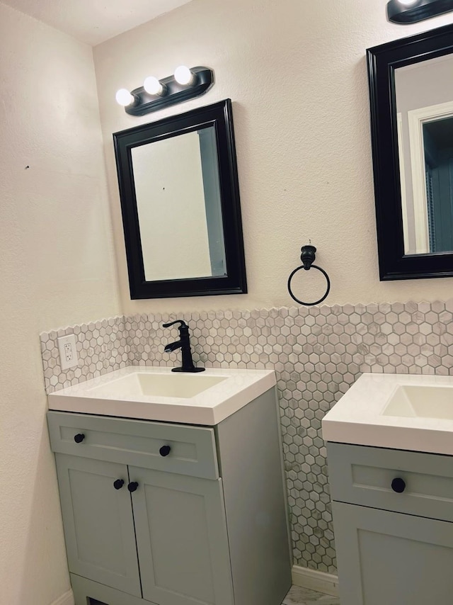 bathroom with vanity and backsplash