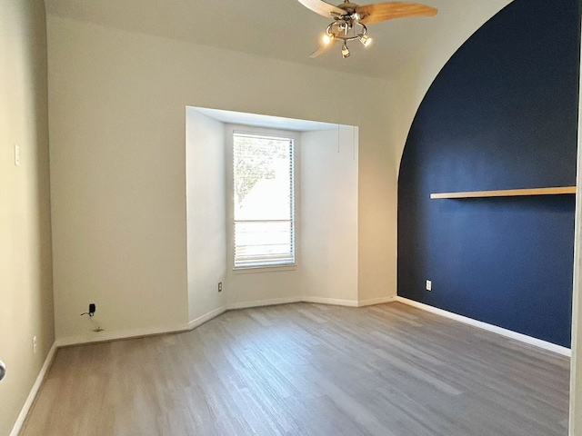 spare room with ceiling fan and hardwood / wood-style floors