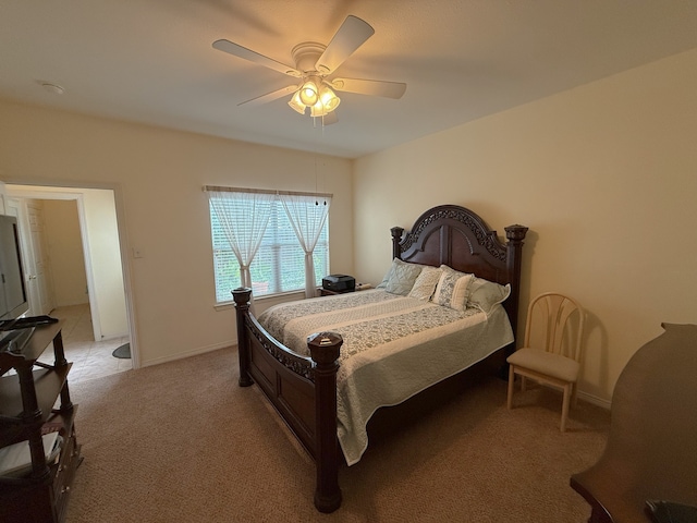 bedroom featuring ceiling fan and light carpet