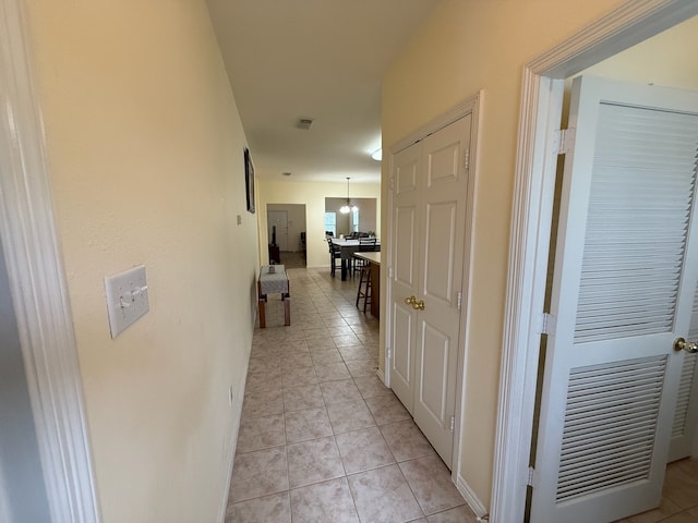 corridor featuring light tile patterned flooring