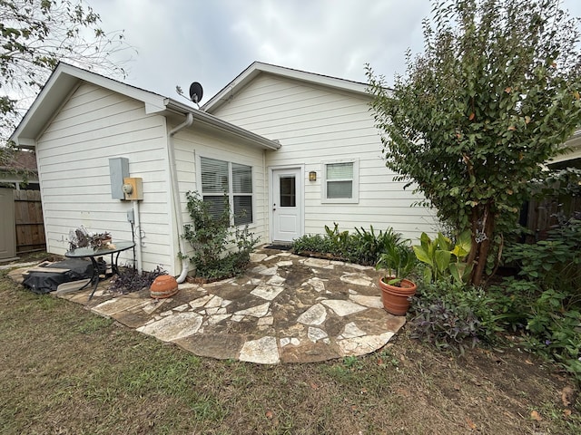 back of property featuring a patio area