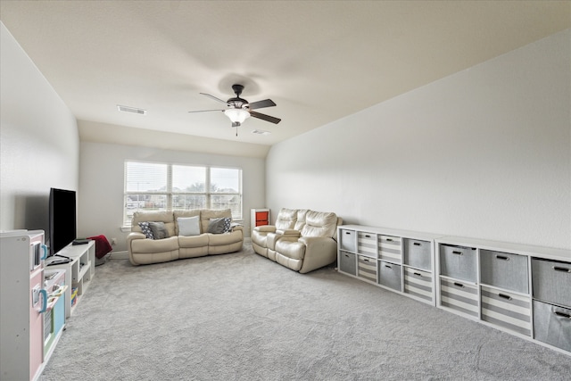 carpeted living room with ceiling fan