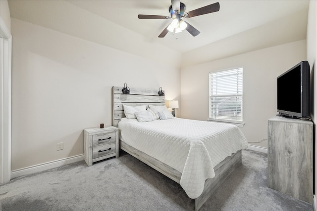 bedroom with ceiling fan and light carpet