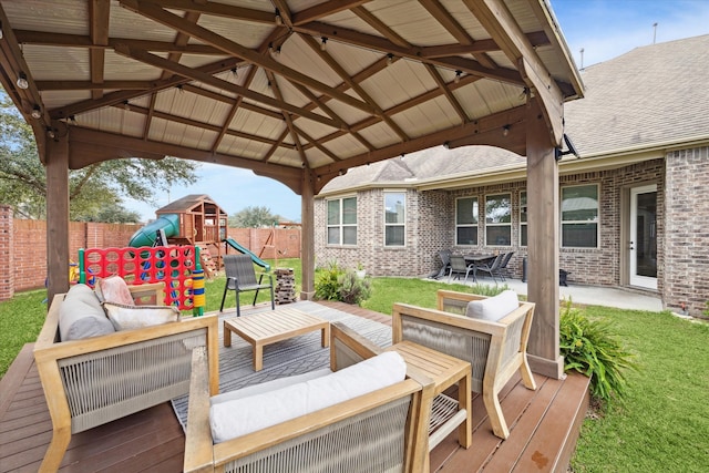 deck featuring a gazebo, a playground, outdoor lounge area, and a lawn