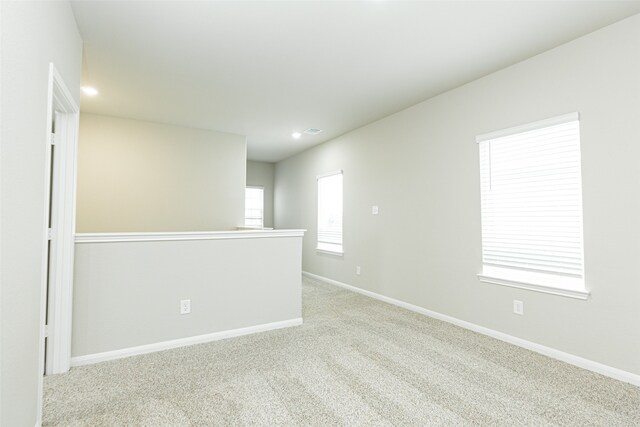 empty room with light colored carpet