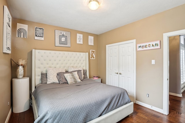 bedroom with a closet and dark hardwood / wood-style flooring