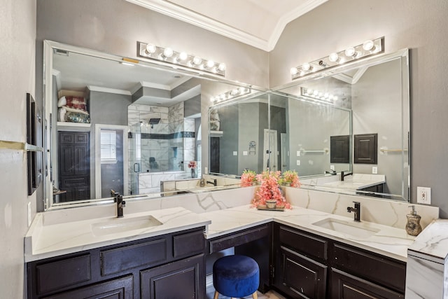 bathroom with vanity, a shower with door, and crown molding