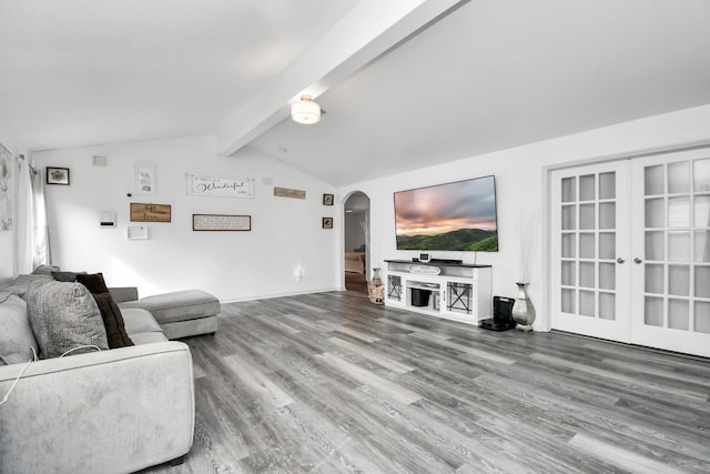 living room with hardwood / wood-style flooring and vaulted ceiling with beams