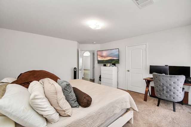 bedroom with light colored carpet