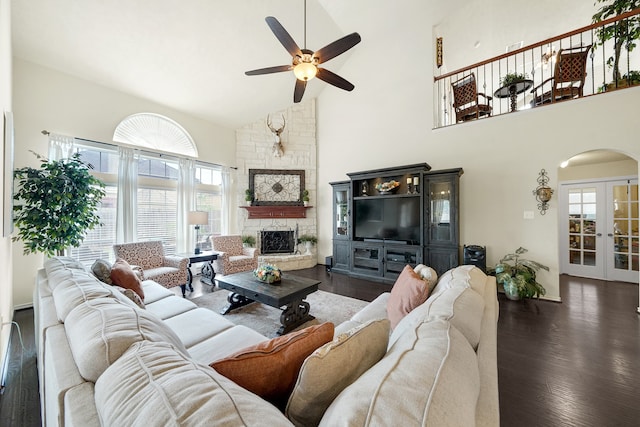 living room featuring ceiling fan, dark hardwood / wood-style flooring, and high vaulted ceiling