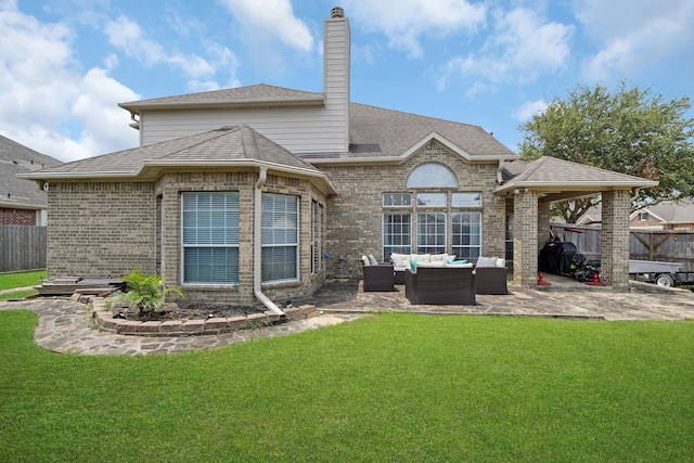 rear view of property with an outdoor living space, a yard, and a patio