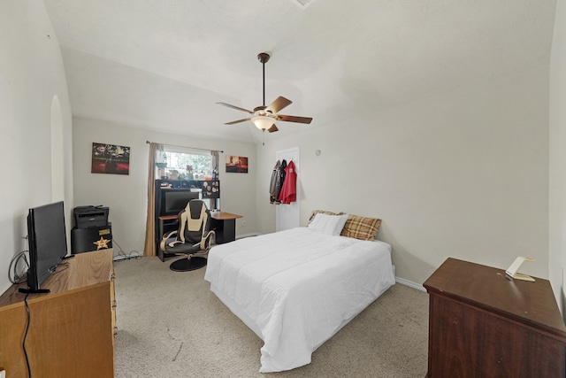 bedroom featuring light carpet and ceiling fan