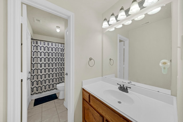 bathroom featuring tile patterned floors, vanity, toilet, and a shower with shower curtain