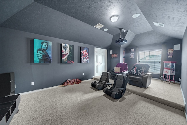 carpeted home theater with a textured ceiling and lofted ceiling