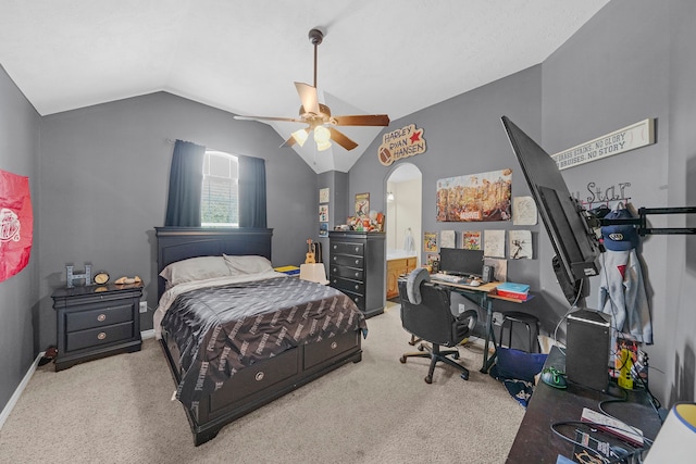 carpeted bedroom featuring ceiling fan and vaulted ceiling