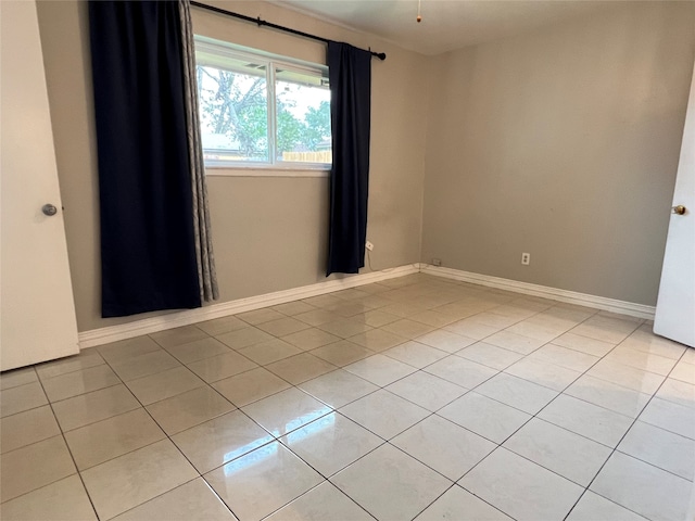 empty room with light tile patterned floors