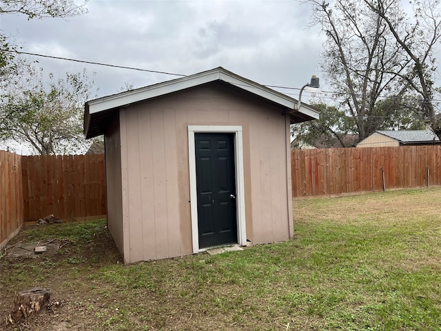 view of outdoor structure featuring a lawn