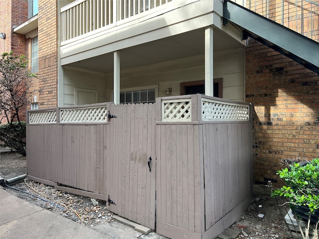 view of side of home featuring a balcony