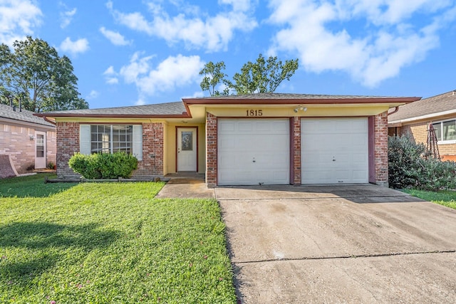 single story home featuring a garage and a front yard