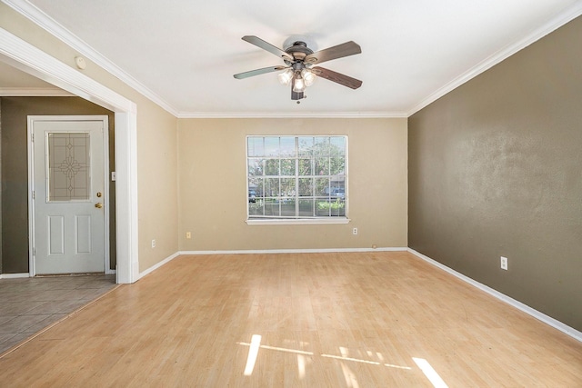 spare room with light wood-type flooring, ceiling fan, and crown molding