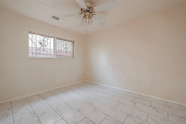 spare room with ceiling fan