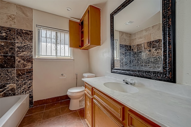 bathroom with tile patterned flooring, vanity, and toilet