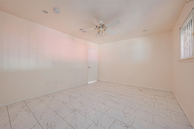 unfurnished room with ceiling fan