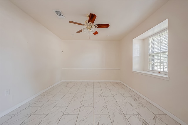 unfurnished room with ceiling fan