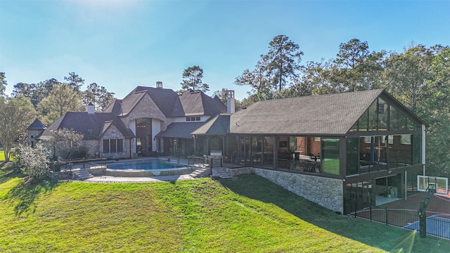 rear view of house with a yard and a patio area