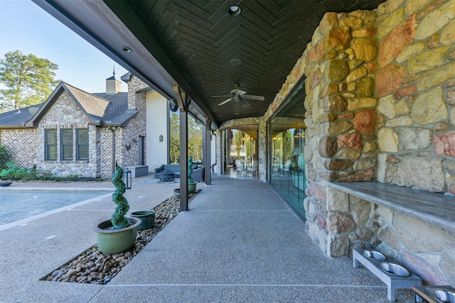 view of patio featuring ceiling fan