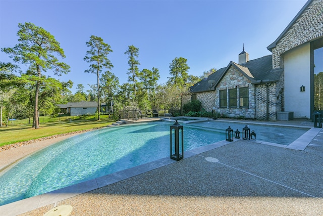 view of pool featuring a yard and a patio area