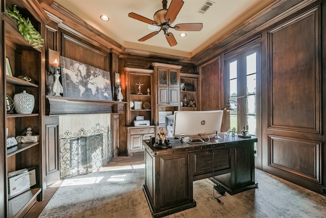 home office with ceiling fan and crown molding