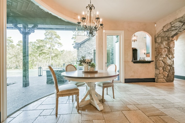 5015 Ossineke Ct, Spring, TX 77386 - dining room with a chandelier and arched walkways