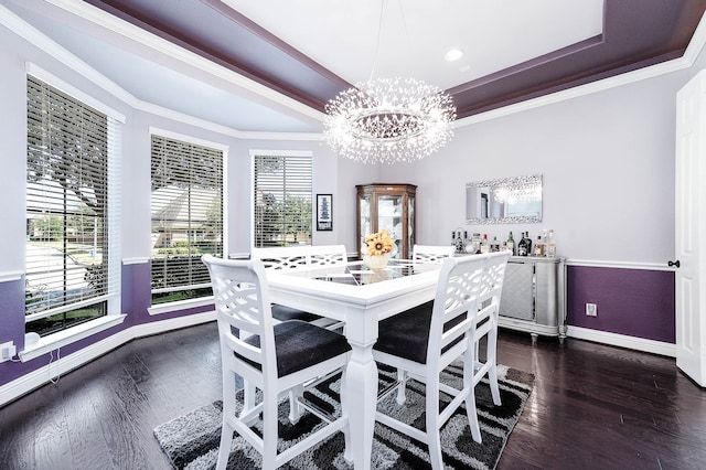 dining room with a notable chandelier, dark hardwood / wood-style floors, and ornamental molding