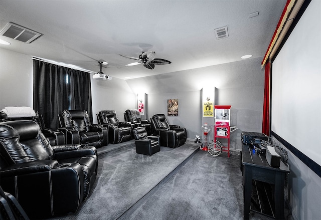 cinema featuring dark carpet, a textured ceiling, vaulted ceiling, and ceiling fan