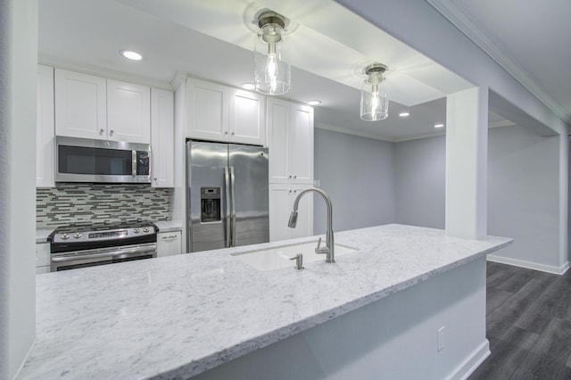 kitchen featuring sink, appliances with stainless steel finishes, light stone countertops, dark hardwood / wood-style floors, and white cabinets