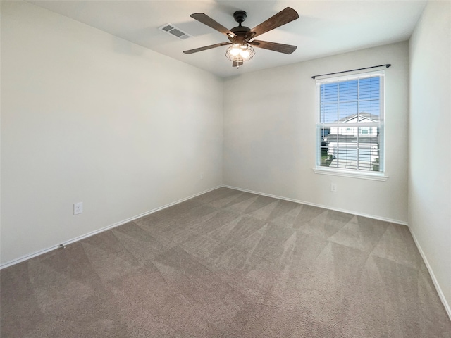 carpeted empty room featuring ceiling fan