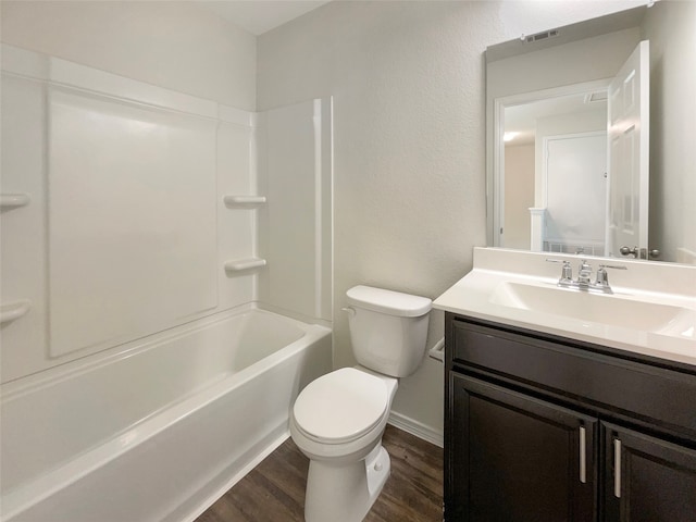 full bathroom with wood-type flooring, vanity, toilet, and bathing tub / shower combination