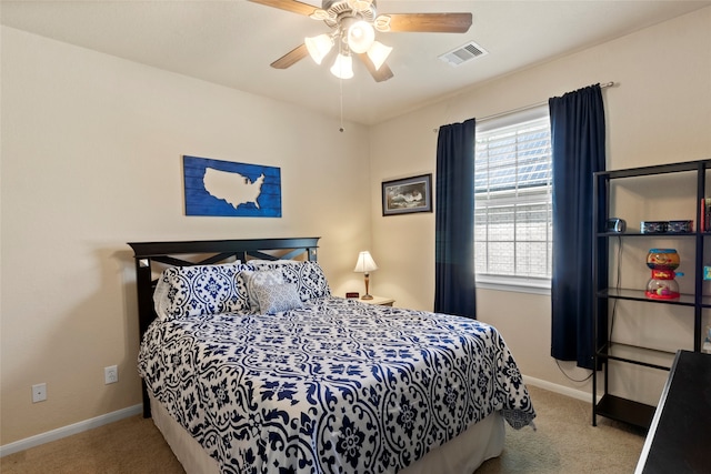 bedroom with light carpet and ceiling fan