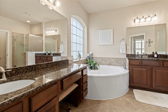 bathroom with vanity, plus walk in shower, and tile patterned flooring