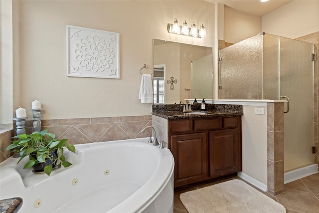 bathroom featuring vanity, tile patterned flooring, and separate shower and tub