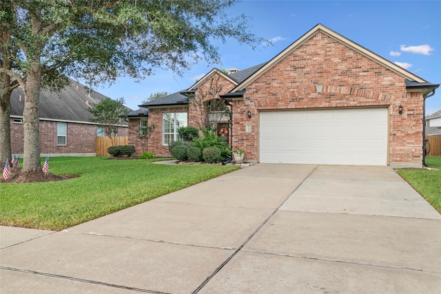 front of property with a garage and a front lawn