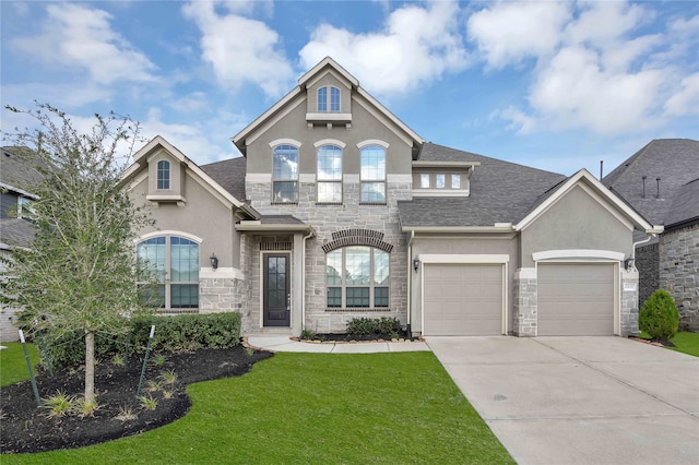 view of front facade with a front lawn and a garage